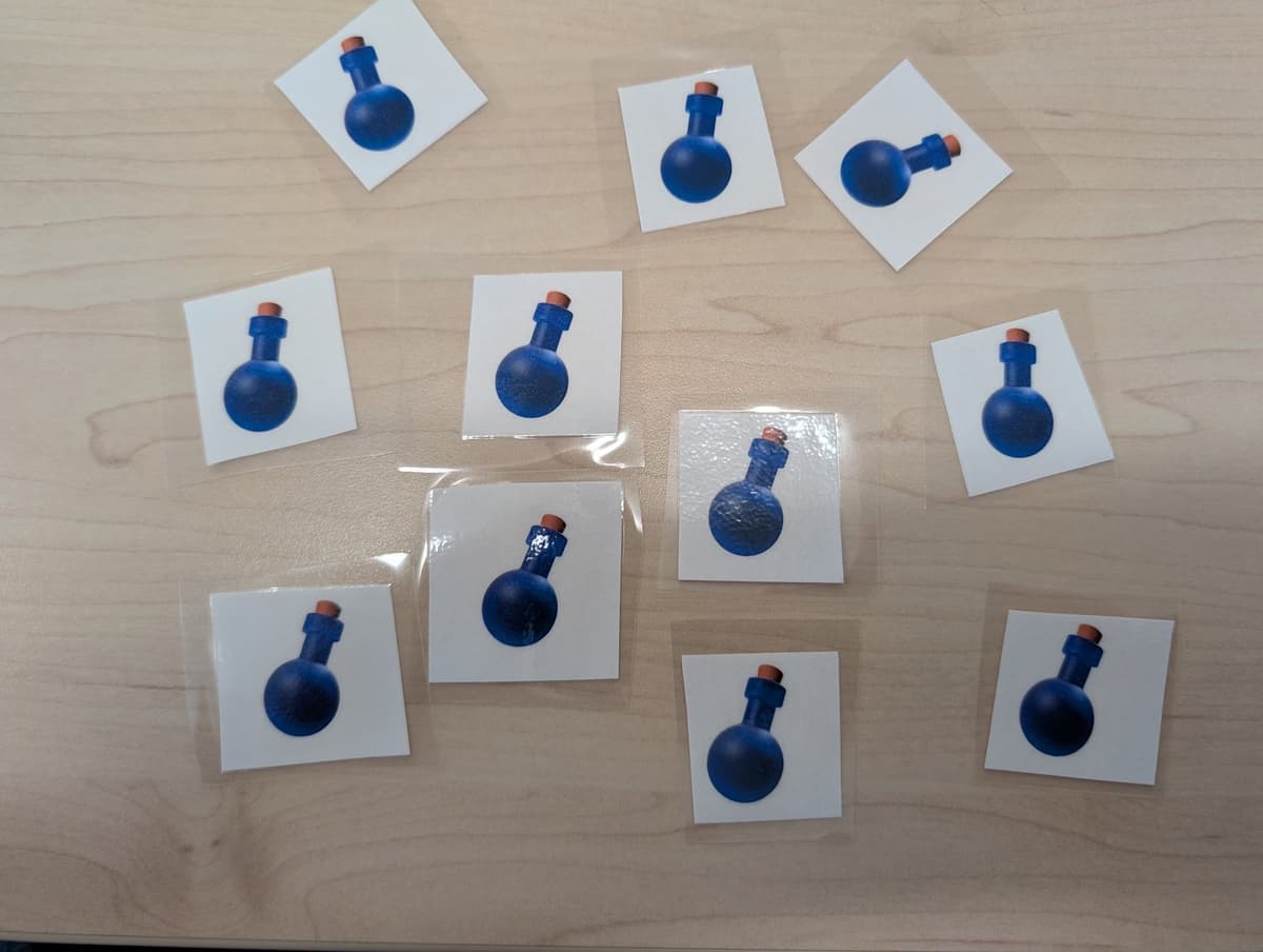 Fiziksel ödül olarak kullanılan lamine iksir kartları